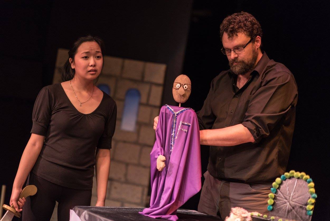 Christopher working a puppet in The Princess Knight (Solar Stage), with April Leung. Photography by Dahlia Katz.